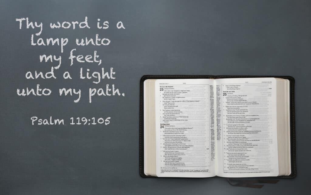 Bible open to Psalm 23, with a quote from Psalm 119 next to it